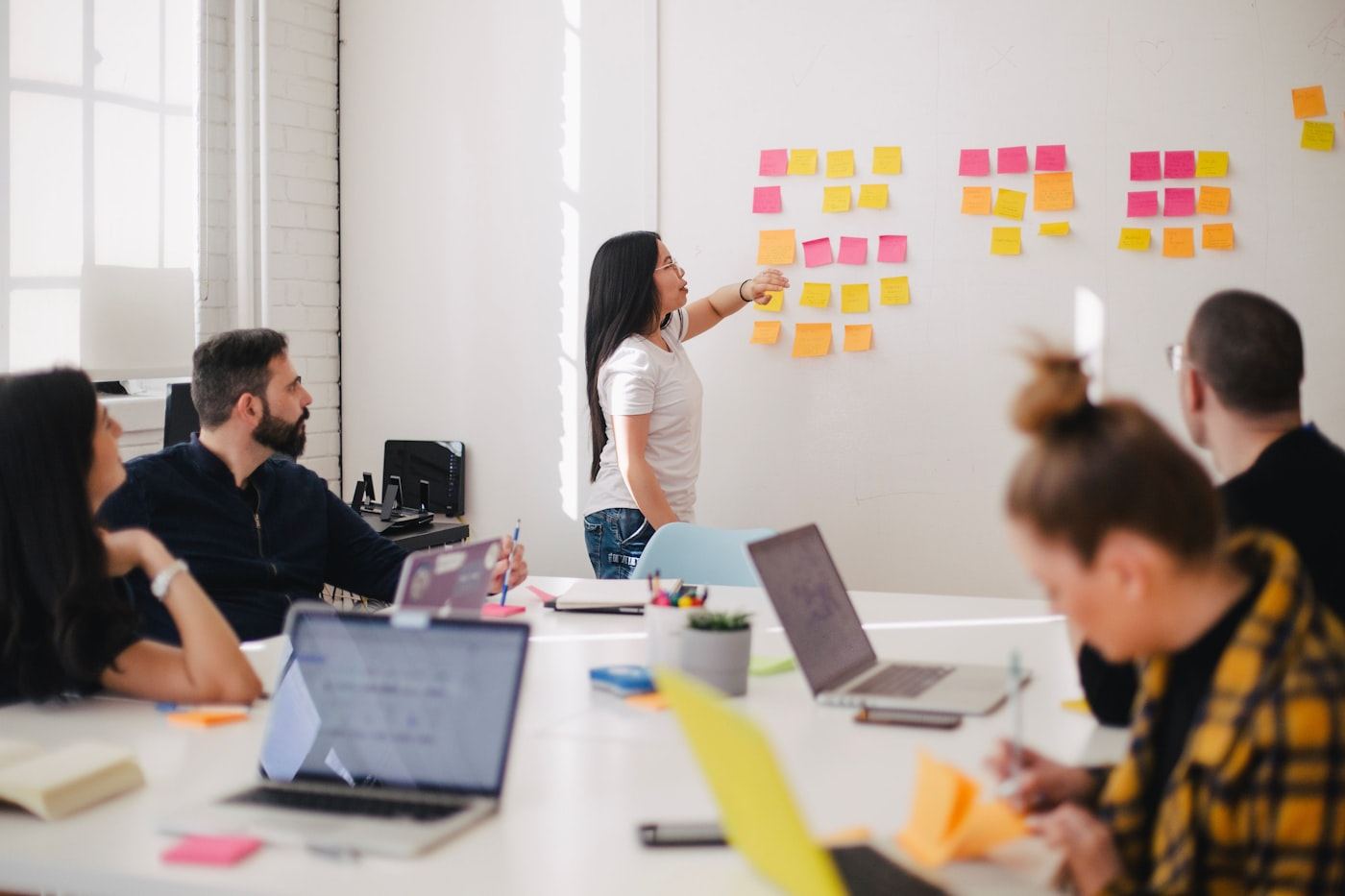 Campaign planning on a wall of notes — mapping how channels share one message.